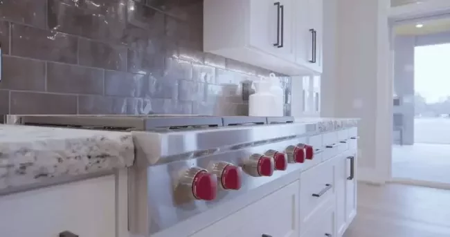 Professional kitchen deep cleaning services in Howell and Brighton, MI, featuring a spotless professional-grade stove and sanitized countertops by Fresh Start Residential Cleaning.